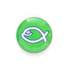 Значок на цанге - Белая юмористическая  рыбка на зеленом фоне